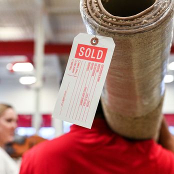 RiteRug Flooring Store & Outlet - Dayton - a man carrying a roll of carpet - Flooring Near Me - Dayton, Ohio RiteRug Flooring Store & Outlet - Dayton - a man carrying a roll of carpet - Flooring Near Me - Dayton, Ohio