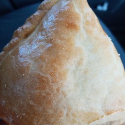 a hand holding a pastry