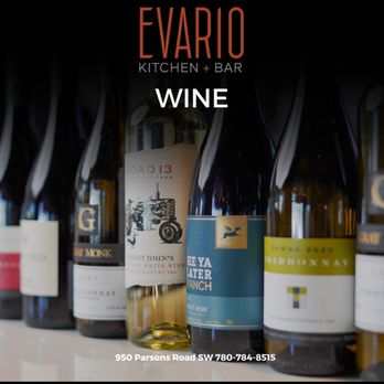 Evario Kitchen + Bar - a row of wine bottles - Italian Near Me - Edmonton, Alberta Evario Kitchen + Bar - a row of wine bottles - Italian Near Me - Edmonton, Alberta