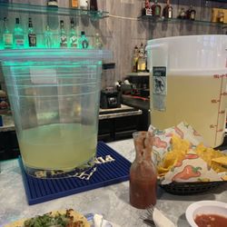 Adelitas Mexican Grill - Buckets of margarita mix just setting on the bar
