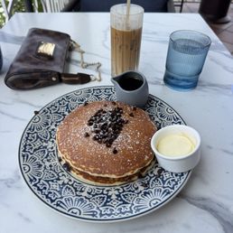 Chocolate chip pancakes with an iced vanilla latte