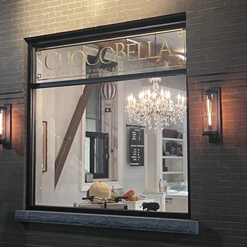 Chocobella - a storefront window with a chandelier in the window - Chocolatiers & Shops Near Me - Florence, South Carolina Chocobella - a storefront window with a chandelier in the window - Chocolatiers & Shops Near Me - Florence, South Carolina