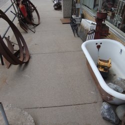 Antiques 101 - Some farm and architectural salvage type items outside, on the front stoop.