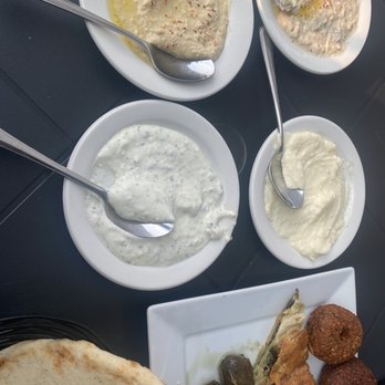 The Kasbah Mediterranean - Garlic pudding, babaganoush, hummus, tzatziki, falafel balls, spanakopita, stuffed grape leaves - Mediterranean Near Me - Niagara Falls, Ontario The Kasbah Mediterranean - Garlic pudding, babaganoush, hummus, tzatziki, falafel balls, spanakopita, stuffed grape leaves - Mediterranean Near Me - Niagara Falls, Ontario
