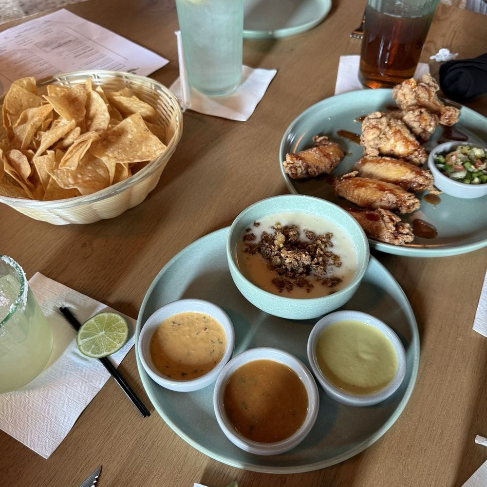 Chino's Cantina - Chips and salsa with queso and the wings appetizer - New Mexican Cuisine Near Me - Yukon, Oklahoma Chino's Cantina - Chips and salsa with queso and the wings appetizer - New Mexican Cuisine Near Me - Yukon, Oklahoma