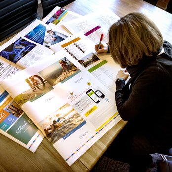 Page Design Group - Production Manager Sherril reviewing client proofs - Web Design Near Me - Sacramento, California Page Design Group - Production Manager Sherril reviewing client proofs - Web Design Near Me - Sacramento, California