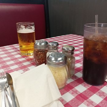 Antonios Pizza - a cold drink and salt shakers - Italian Near Me - Belpre, Ohio