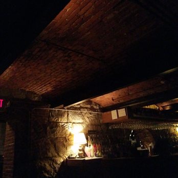 The Cave - a man sitting at a bar - Bars Near Me - Carroll, New Hampshire