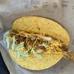 Broken taco with no lettuce. Broken taco with no lettuce.