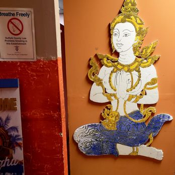 Thongpanchang - a picture of a statue on a wall - Thai Near Me - Blue Point, New York Thongpanchang - a picture of a statue on a wall - Thai Near Me - Blue Point, New York