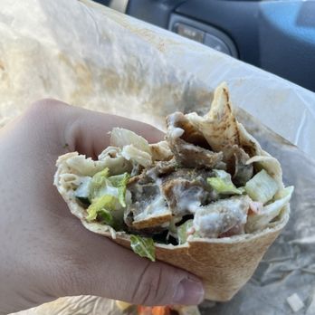 Pita Way - Dewitt - A half eaten Detroit Gyro Shawarma - Mediterranean Near Me - DeWitt, Michigan Pita Way - Dewitt - A half eaten Detroit Gyro Shawarma - Mediterranean Near Me - DeWitt, Michigan