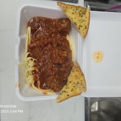 Homemade spaghetti and meatballs are delicious with french toast.