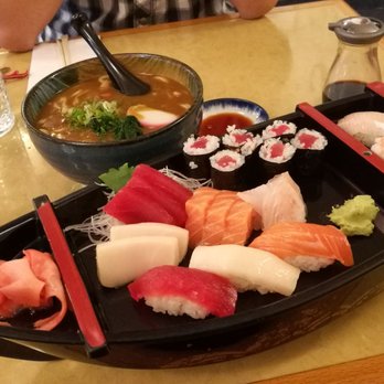 Shiki - Sushi platter with 9 pieces and tekki roll. Curry udon in the back. All SO GOOD! - Japanese Near Me - Rochester, New York