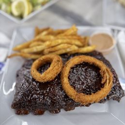 Half rack of ribs (comes with onion rings and fries)