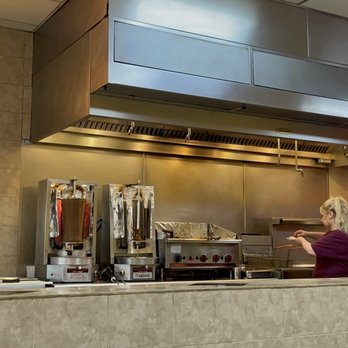 Greek Cafe - a woman preparing food in the kitchen - Greek Near Me - Colorado Springs, Colorado Greek Cafe - a woman preparing food in the kitchen - Greek Near Me - Colorado Springs, Colorado