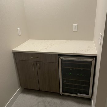 Lion Stoneworks - a wine cooler in the corner of a kitchen - Kitchen & Bath Near Me - Denver, Colorado