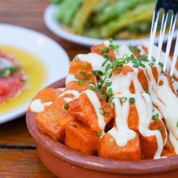 Barceloneta - a plate of food with a fork in it - Spanish Near Me - Miami Beach, Florida