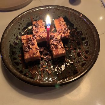 Ember Kitchen - Dessert. Chocolate cake layered with flan and drizzled with caramel and chocolate pieces. - Latin American Near Me - Austin, Texas