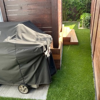 Turfside - Looks great in a tight area + they seamlessly tied into pavers under grill. - Artificial Turf Near Me