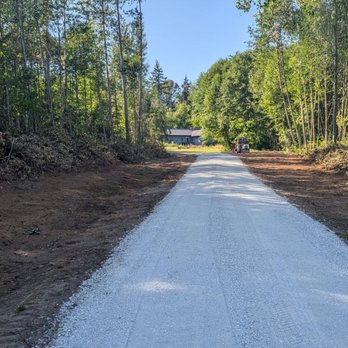 Done Well Dirt Works - The road going to the house now looks very impressive.  Clover will be planted along the road to contain future enroachment - Excavation Services Near Me