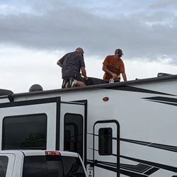 Moonlighting Mobile RV Repair - On the roof making sure your RV AC is ready for the Texas heat.