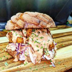 Hen & Heifer - The Chicki Bombon! Fried Chicken tenders with a Fresh Mexican Concha acting as buns.