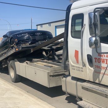 Maq's Towing - A couple of towed vehicles. Look at that red tractor - Towing Near Me Maq's Towing - A couple of towed vehicles. Look at that red tractor - Towing Near Me
