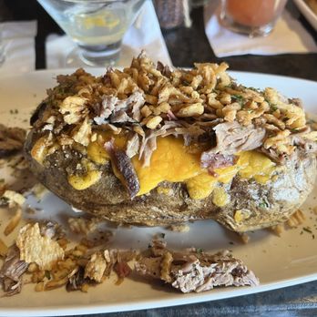 Copper Kettle Distilling Company - Baked potato with pulled pork. - Distilleries Near Me - Prudenville, Michigan Copper Kettle Distilling Company - Baked potato with pulled pork. - Distilleries Near Me - Prudenville, Michigan