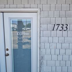 US Med Express - US Med Express front door to office located on the far side of Lighthouse Yoga Studio building at the corner of Dawson St. and Oleander Dr.