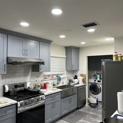 Asia Building Supply - White Calcatta Quartz and Grey Shaker Cabinets