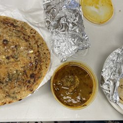 Punjabi Dhaba - Goat curry, parantha, roti and raita.
