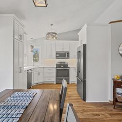 Lakeside Cabinets and Woodworking - White Kitchen Custom Cabinets designed for the client per their specification and needs.