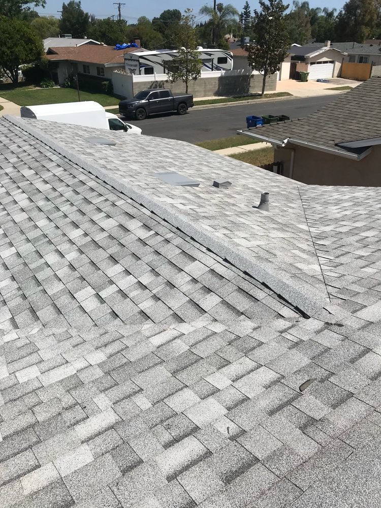 Slide of Mencho's Roofing & Repairs