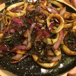 La Regadera - Ink fish rings with red onion and seaweed, plus shrimps