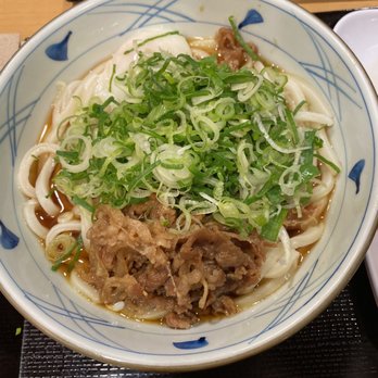 Marugame Udon - Nikutama Udon with self serve onions and tempura flakes. - Japanese Near Me - Honolulu, Hawaii Marugame Udon - Nikutama Udon with self serve onions and tempura flakes. - Japanese Near Me - Honolulu, Hawaii