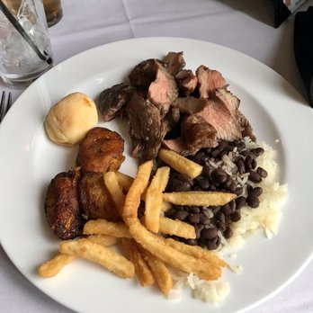 Oliveira's Steak House - By weight- around $10. Rice with beans, plantains, cheese breads, and sirloin - Brazilian Near Me - Somerville, Massachusetts Oliveira's Steak House - By weight- around $10. Rice with beans, plantains, cheese breads, and sirloin - Brazilian Near Me - Somerville, Massachusetts