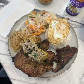 Pho Dena - Com Tam Suon Bi Cha Trung - broken rice with pork chop, pork skin, egg custard and a sunny side up egg - Vietnamese Near Me - Pasadena, Maryland Pho Dena - Com Tam Suon Bi Cha Trung - broken rice with pork chop, pork skin, egg custard and a sunny side up egg - Vietnamese Near Me - Pasadena, Maryland