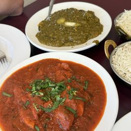 Chicken Vindaloo red sauce combine with delicious spices, Chicken Saag with light butter on top unique green flavored sauce.