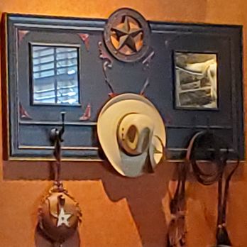 LongHorn Steakhouse - a cowboy hat hanging on a wall - Steakhouses Near Me - Heath, Ohio