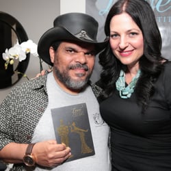 The Love Institute - Actor Luis Guzman and Meagan Holub, Celebrity Massage Therapist and Founder of The Love Institute at the Oscars Gift Suite.