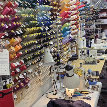 Sun's Alterations & Dry Cleaning - The thread spools with threads of many colors. - Sewing & Alterations Near Me - Roanoke, Virginia