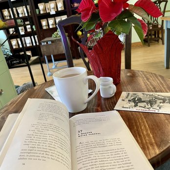 Cup & Kettle Tea - an open book on a table - Coffee & Tea Near Me - Bloomington, Indiana