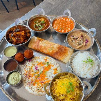 Everything Spice - a plate of food on a table - Indian Near Me Everything Spice - a plate of food on a table - Indian Near Me