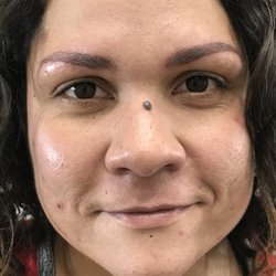 Natural brow enhancement done with microblading.