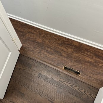 Eduardo Carpet & Floors - Interior new closet with heating vent; existing hardwood leading to new closet also shown - Carpet Installation Near Me Eduardo Carpet & Floors - Interior new closet with heating vent; existing hardwood leading to new closet also shown - Carpet Installation Near Me