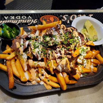 406 Kitchen & Taproom - a plate of fries and a bowl of salsa - New American Near Me - Billings, Montana