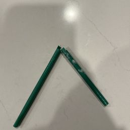 a green straw and a green pencil