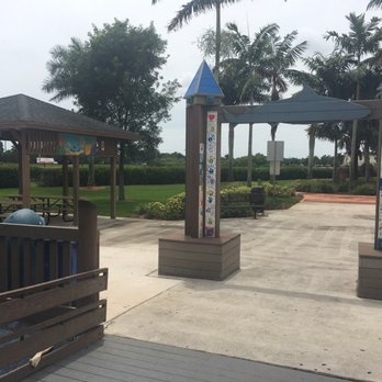 Tiger Shark Cove Park - The SOLE EXIT is wheelchair accessible and leads to a lovely walking path and shaded greens. - Playgrounds Near Me - Wellington, Florida Tiger Shark Cove Park - The SOLE EXIT is wheelchair accessible and leads to a lovely walking path and shaded greens. - Playgrounds Near Me - Wellington, Florida