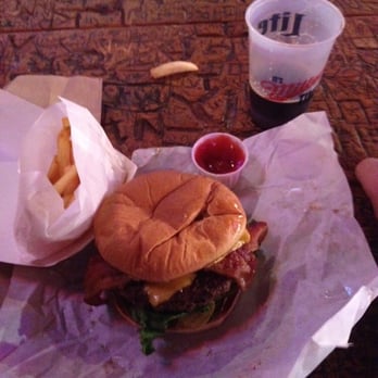 Dixie Chicken - Half pound bacon cheese burger, fries, and disappearing beer - American Near Me - College Station, Texas