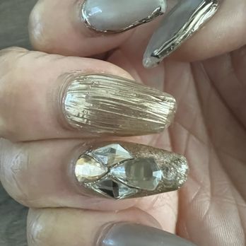 The X Nail - paint chipping, one of the stones came off, the ends are curving back and breaking off. - Nail Salons Near Me - Ontario, California